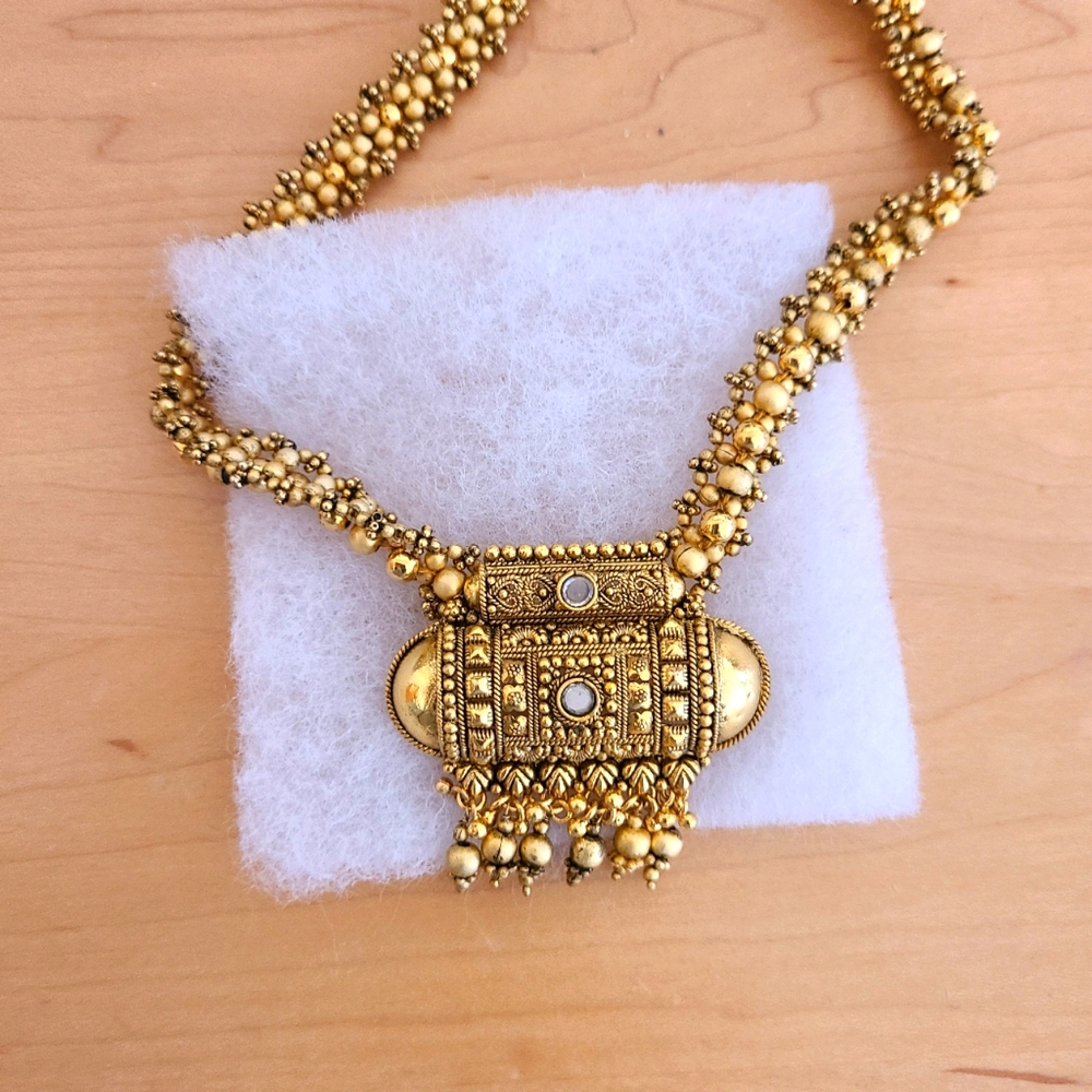 Gold plated on silver necklace and earrings.